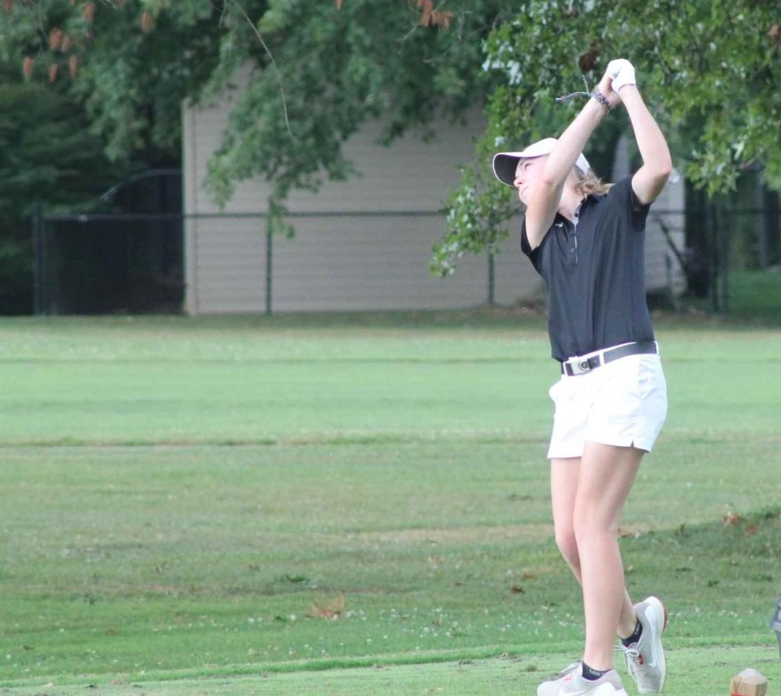 MCHS Senior Golfer Emma Beasley holds her finish.