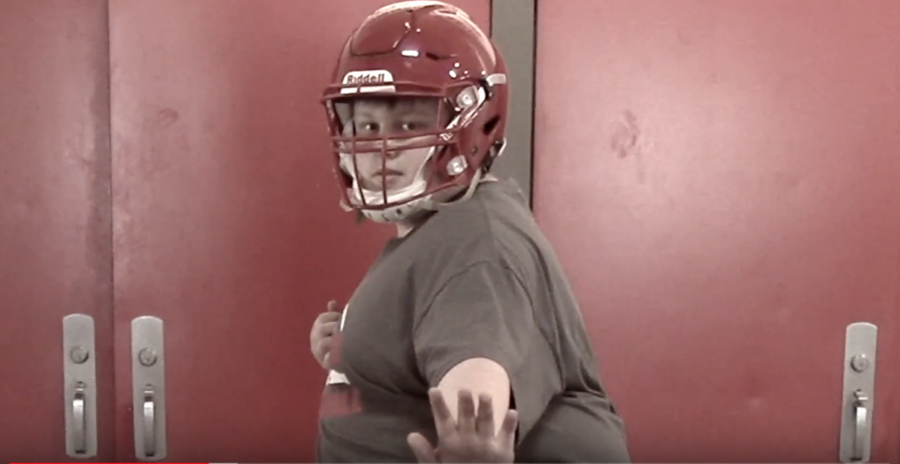 The Madisonian staffer, Collin Birge, in the Heisman Trophy pose.