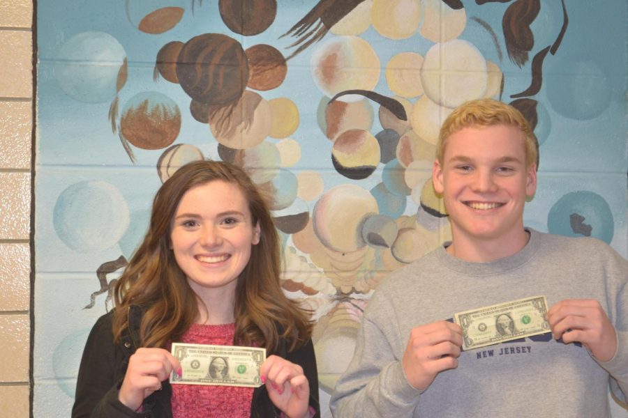 Seniors+Hannah+Huff+and+Eoin+McMahon+display+dollar+bills+after+winning+the+most+likely+to+be+a+millionaire+superlative.