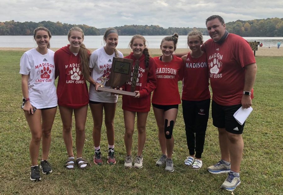The+2019-2020+sectional+champion+Lady+Cubs+Cross+Country+team.+From+left%3A+Isabel+Wilber%2C+Cameran+Cahall%2C+Chloe+Ferris%2C+Brett+Cahall%2C+Ava+Spencer%2C+Cadence+Traylor%2C+and+Coach+Josh+Wilber