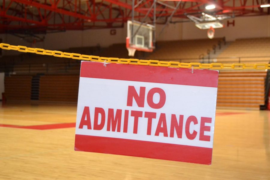 A no admittance sign hangs before an entrance to Connor K. Salm Gymnasium.