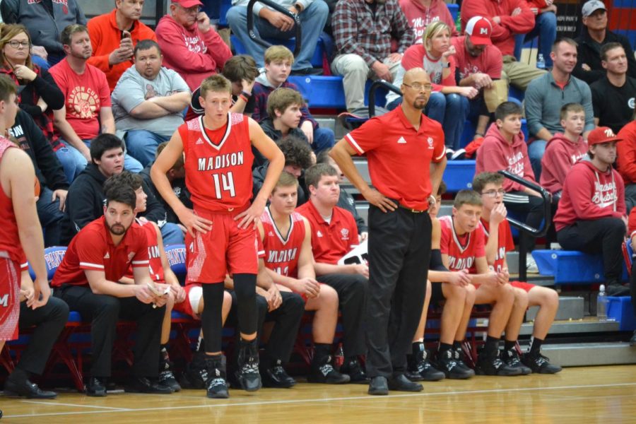 Senior forward Luke Ommen stands with Coach Sherron Wilkerson in a game last year.