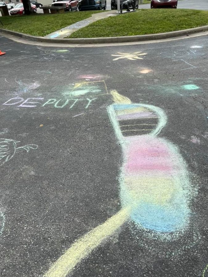Sidewalk chalk art outside of Deputy elementary.