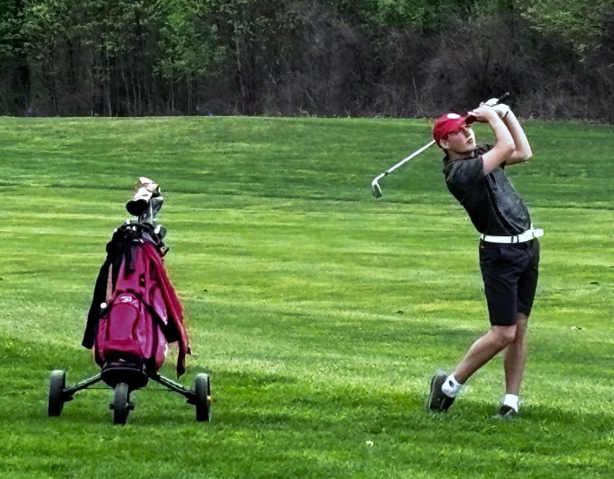 MCHS golfer, Clayton Benkert, studies his approach in the state finals at Prairie View in 2024.