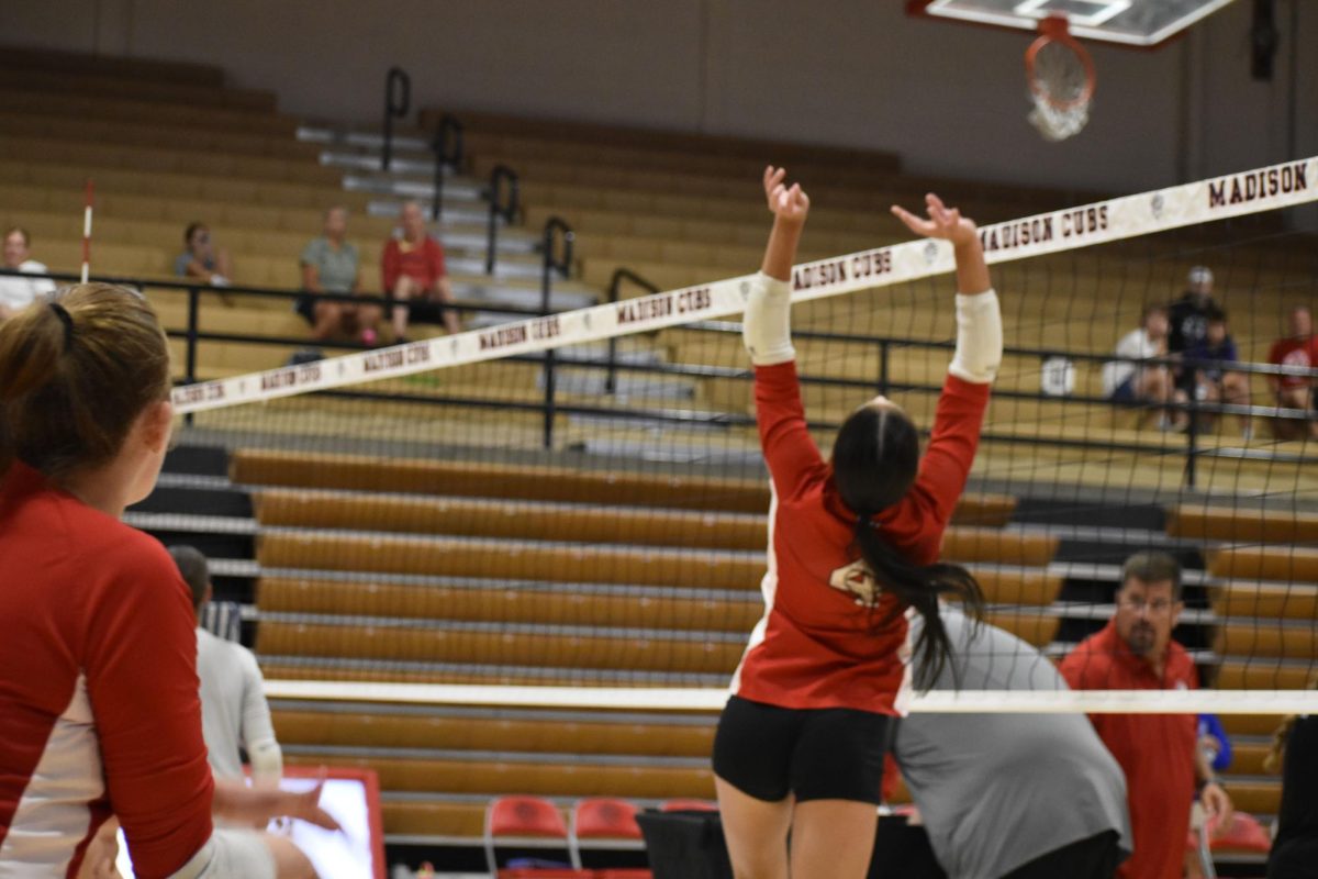 Audrey Miller sets the ball during pre-game warmups.