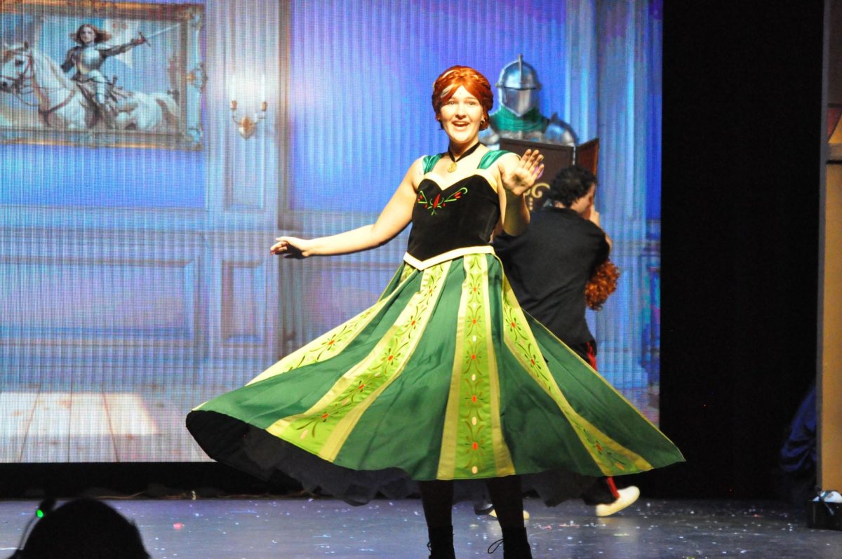 MCHS sophomore, Claire Miller, twirls onstage as Anna in Disney's theatrical version of 'Frozen'.